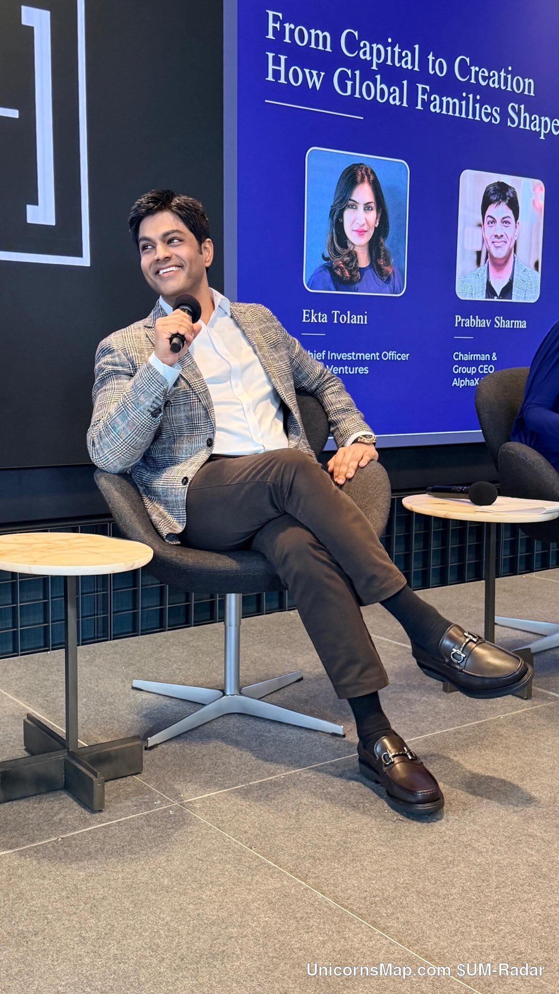 Family Office Cross-Border Investment Forum New York 2026 — a single speaker on stage with a microphone in front of the session's 'From Capital to Creation' slide