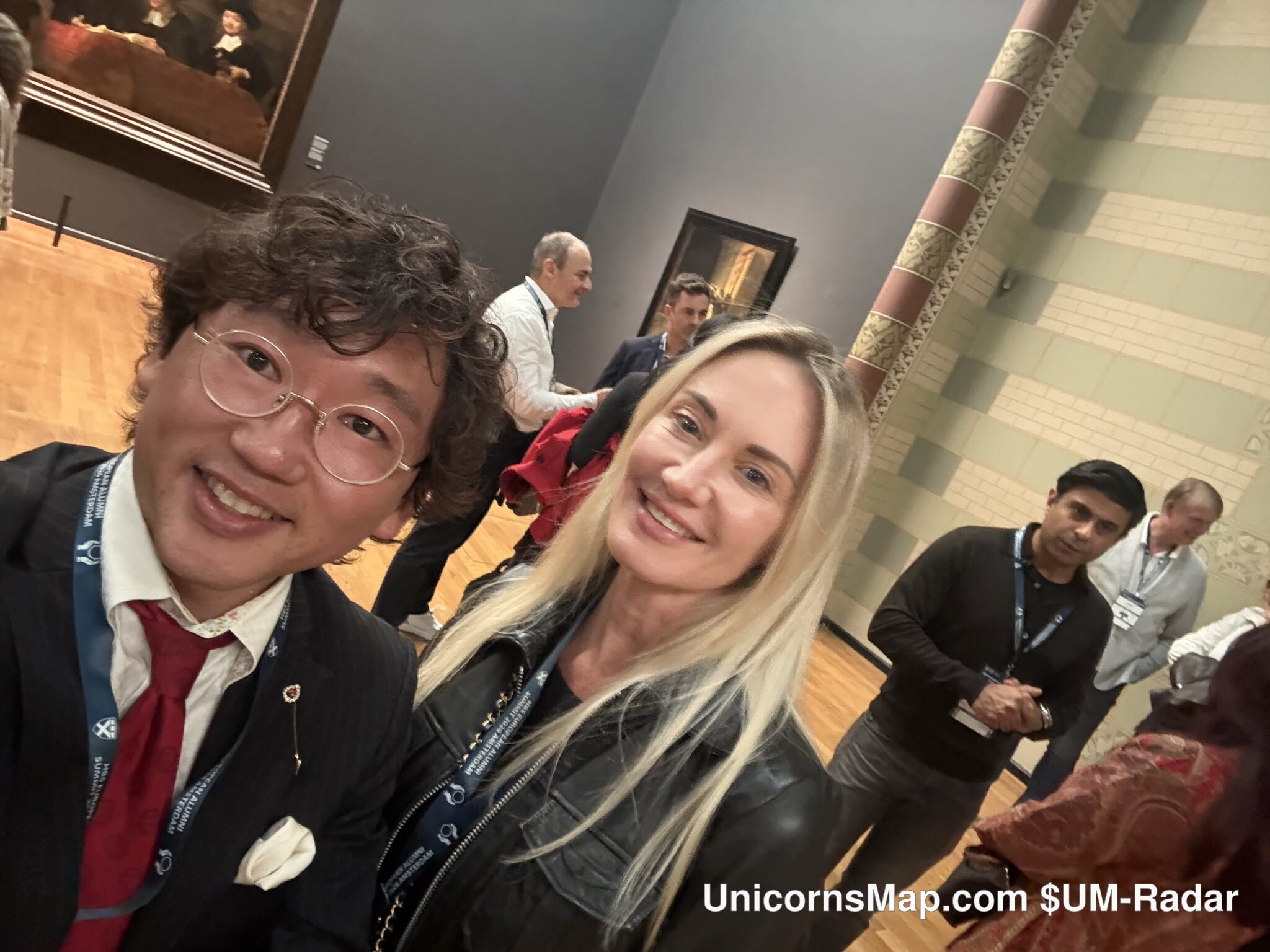 HBS European Alumni Summit 2026 Amsterdam — day-of networking frame in an art-gallery room during the summit's cultural programme