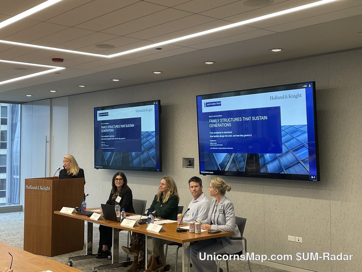 The Modern Family Office: Governance in an Era of Complexity — the Holland & Knight Chicago panel on stage, a lectern and four seated panelists with dual presentation screens