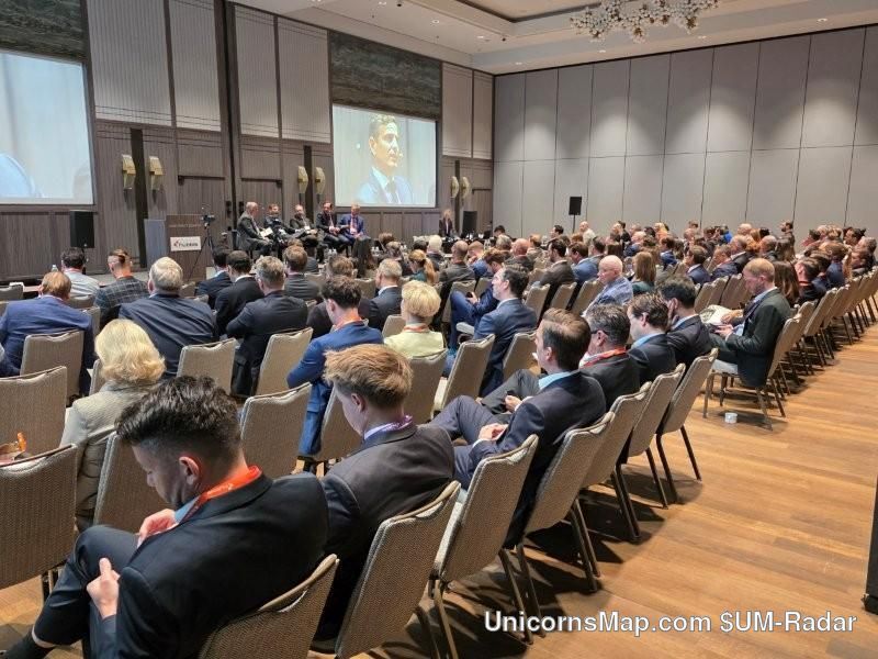 HNW Insurance Summit Zurich 2026 — the conference hall at the Park Hyatt Zurich during a plenary session, with the seated audience and the stage panel on screen