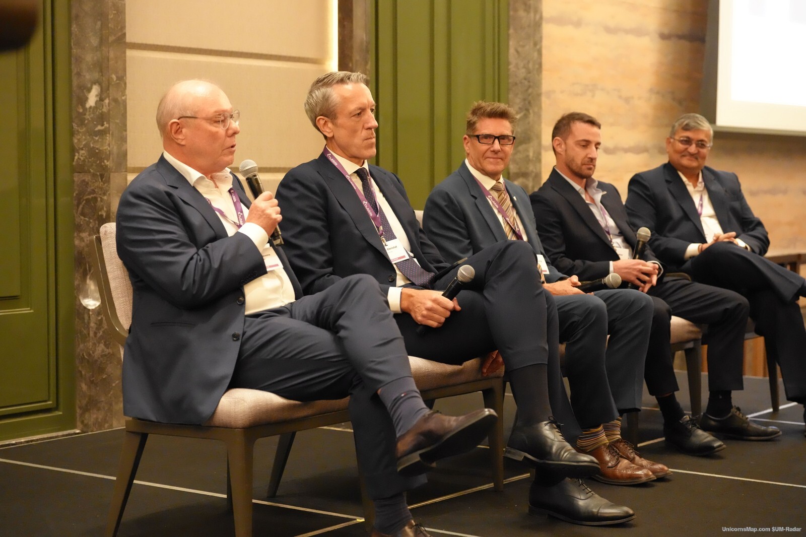 Wealth Planning & Structuring Forum Hong Kong 2026 — a five-person panel seated on stage with handheld microphones at The St. Regis Hong Kong