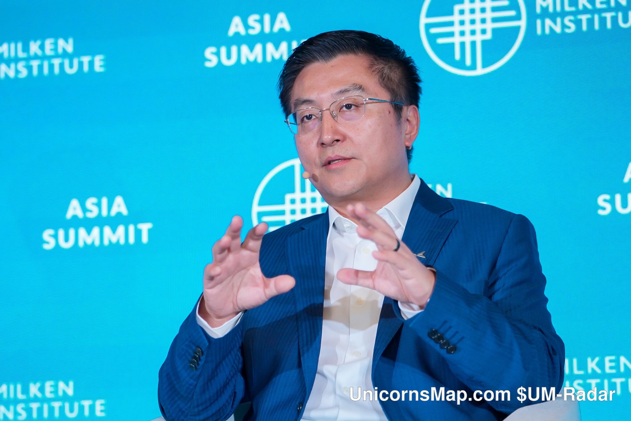 Milken Institute Asia Summit 2026 — Brian Gu (XPENG), Vice Chairman & President, on stage at the Four Seasons Hotel Singapore