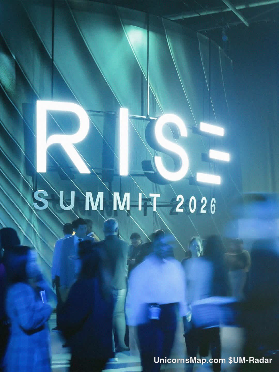 RISE Summit 2026 - attendees at the venue entrance beneath the event's own illuminated RISE / SUMMIT 2026 sign