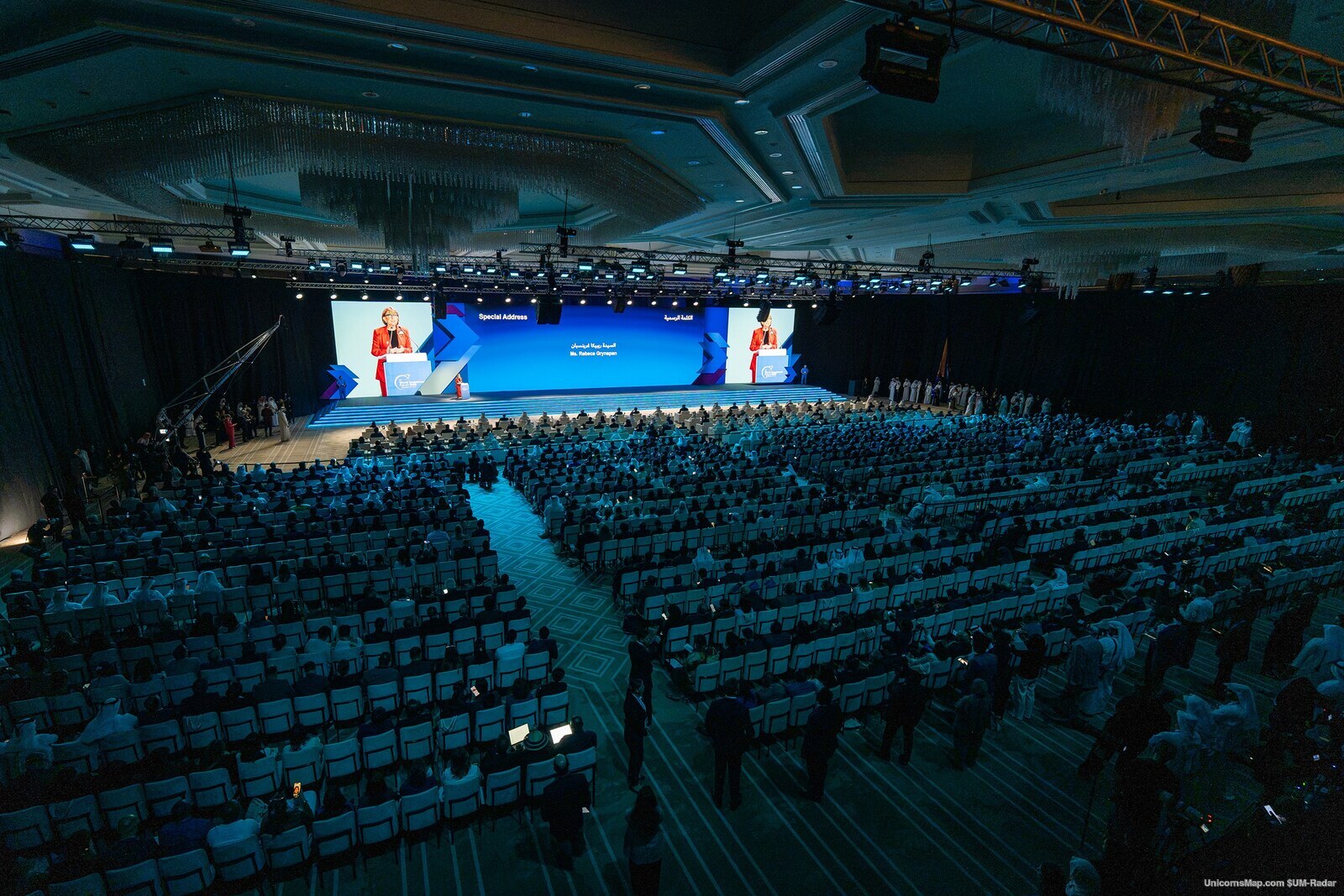 World Investment Forum 2026 Doha — the plenary hall seen from the back during the opening ceremony, filled to the rear rows, with the session screens on stage