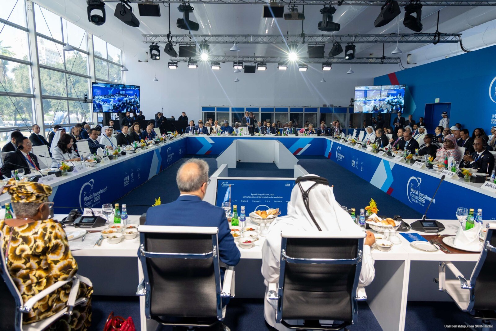 World Investment Forum 2026 Doha — a wide view of the ministerial roundtable room with the U-shaped table, delegates, screens and the WIF 2026 Doha branding