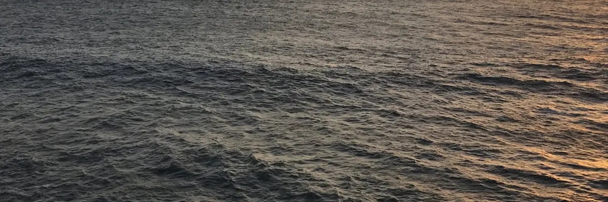Abram Dawson X profile banner — open water at dusk