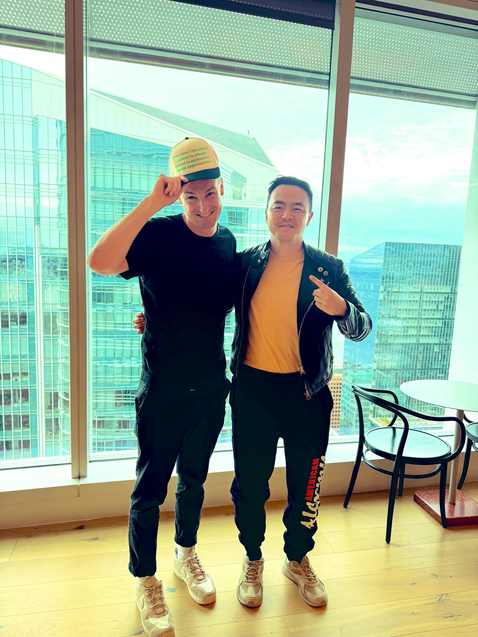 Coinbase HQ SF context frame - credited @alexdolbun (X, 2026-02-25) San Francisco high-rise interior frame - Coinbase HQ context